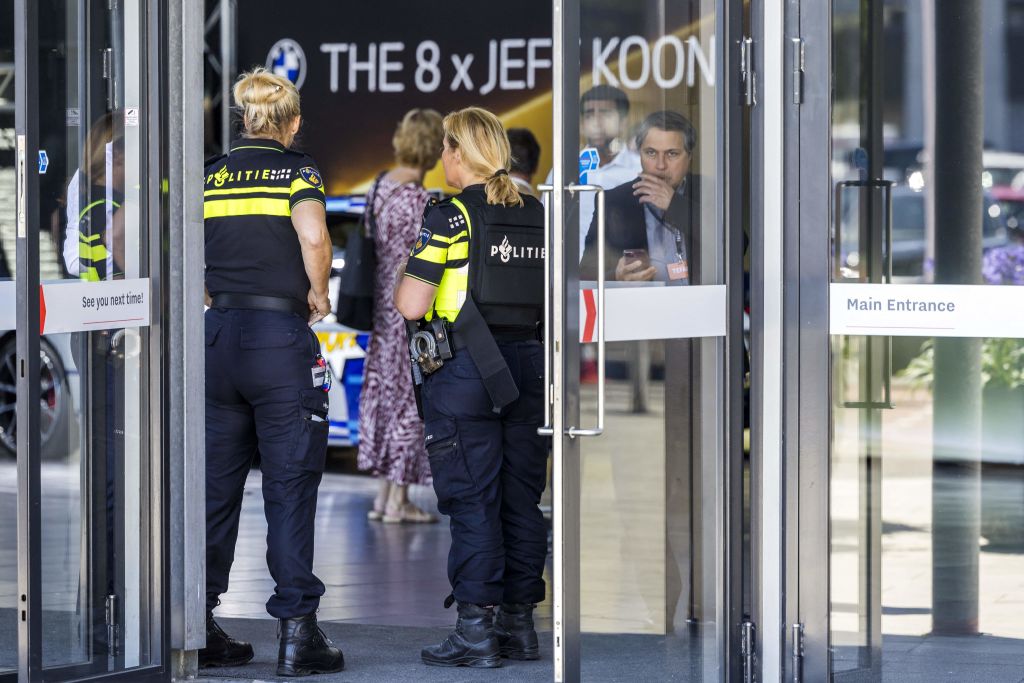 Dutch police officers stand guard at the entrance of the TEFAF Art Fair in Maastricht on June 28, 2022, following a robbery. - Armed robbers raided the TEFAF, one of the world's leading art fairs, in the Dutch city of Maastricht on June 28, 2022, police said, with video showing them smashing a display case using a sledgehammer. - Netherlands OUT (Photo by Marcel van Hoorn / ANP / AFP) / Netherlands OUT (Photo by MARCEL VAN HOORN/ANP/AFP via Getty Images)