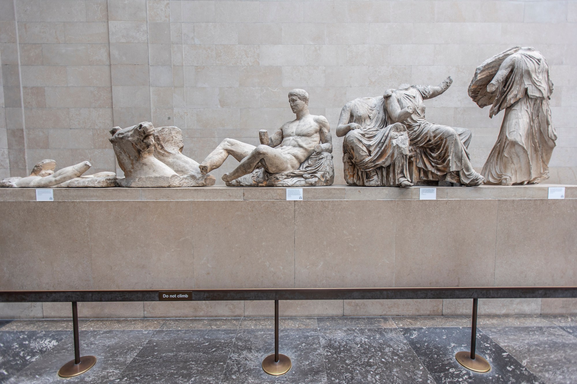 People admire the Parthenon Marbles inside the Parthenon Galleries in the British Museum. The marbles are also known as Elgin Marbles, with sculptures are artifacts of the frieze and the East Pediment from the Parthenon in the Acropolis of Athens. The marbles are displayed to visitors in the British Museum. The Greek government is in dispute with the British government and the museum, demanding the return of the marbles. London, United Kingdom UK on August 2022 (Photo by Nicolas Economou/NurPhoto via Getty Images)